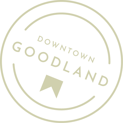 Black and gold circular logo for downtown Goodland with a minimalist design, highlighting new homes in Goodland TX.
