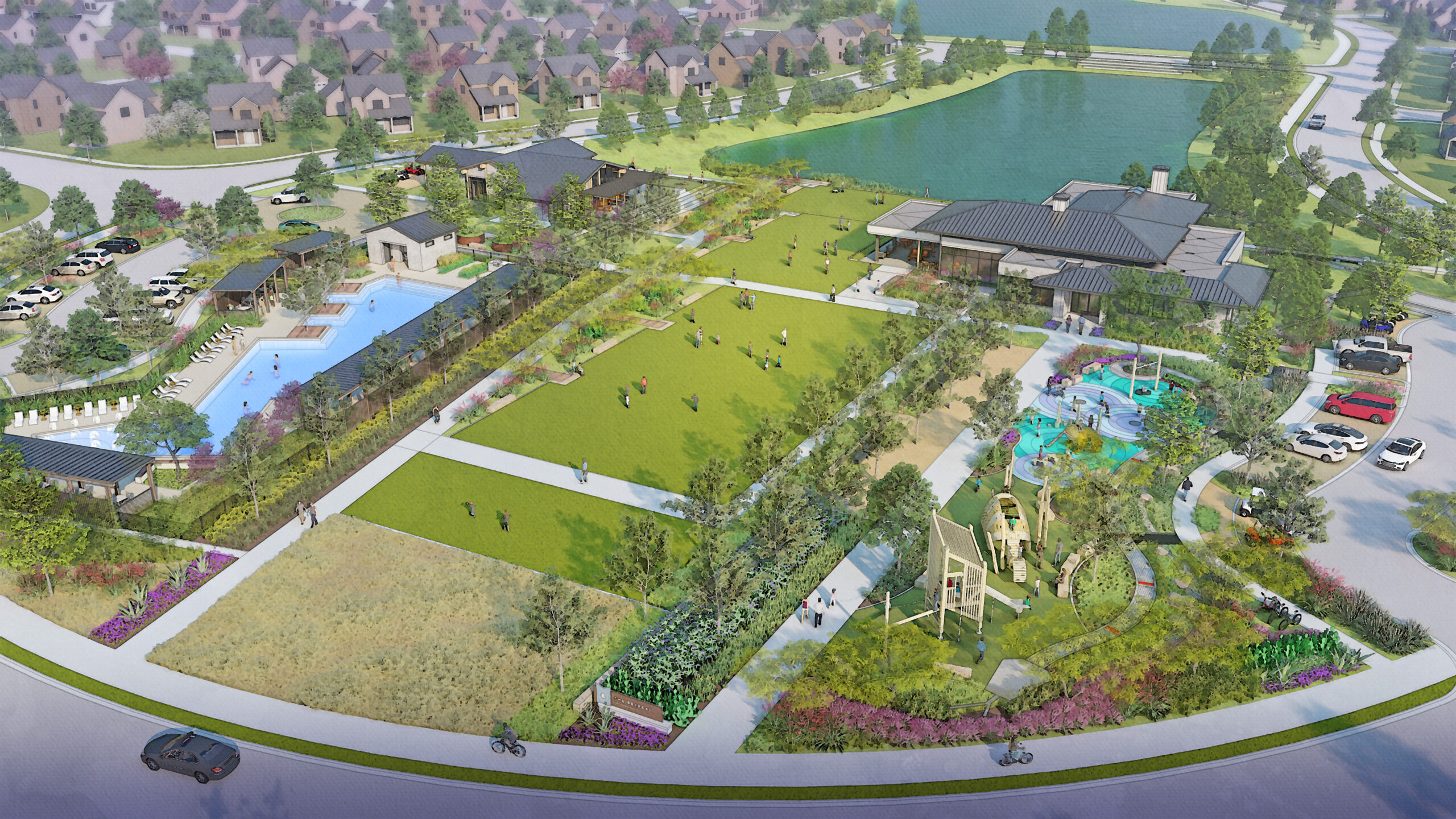 Aerial view of a community park with open green spaces, swimming pool, playground, walking paths, nearby buildings, parking lots, and a pond, surrounded by residential houses.